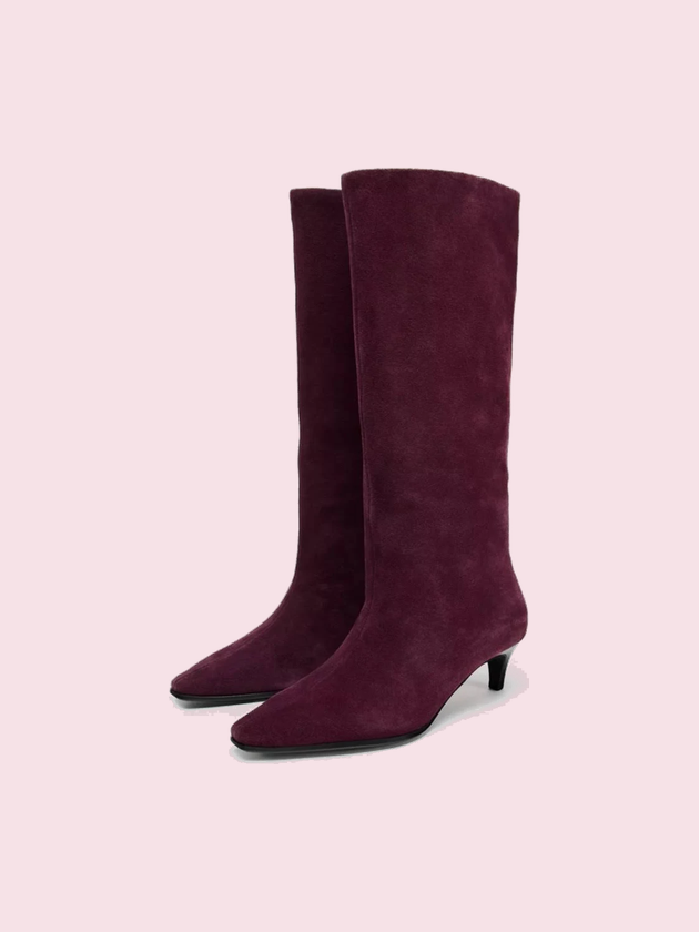 A pair of suede boots she has opened to her court