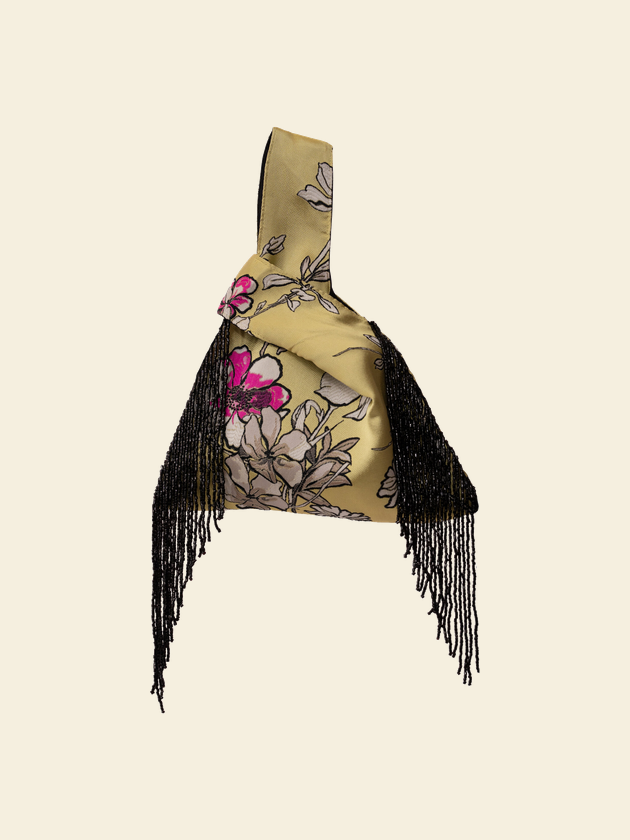 A beaded knot bag, open to one court